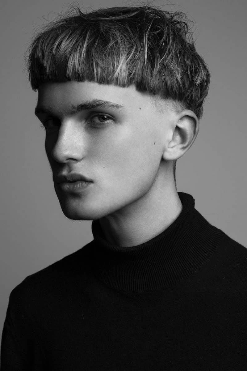 man with bowl cut haircut, black and white.