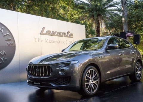 Maserati Levante SUV displayed against lush backdrop.