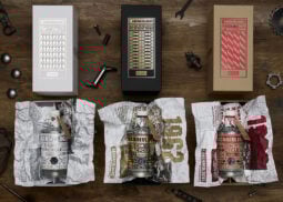 Three "The Archaeologist" boxes with bottles and tools.