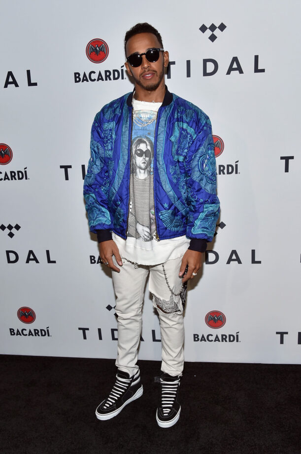 Lewis Hamilton Wears Louis Vuitton Souvenir Jacket and Sneakers at