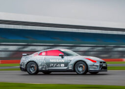 A Nissan sports car races with PS4 Pro branding.