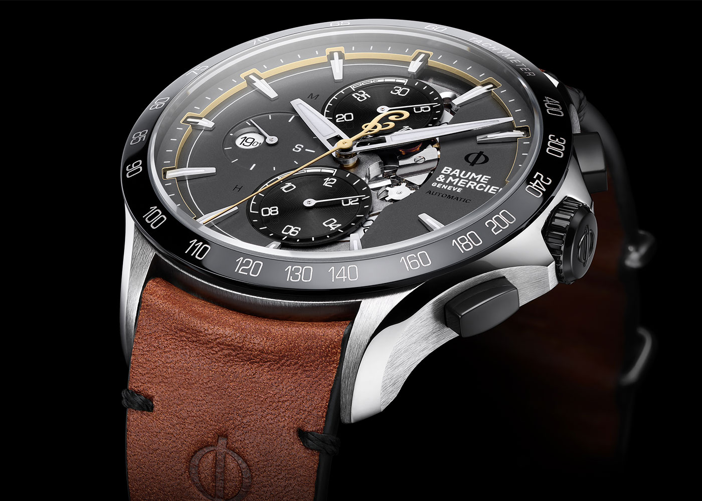 Baume & Mercier watch: dark dial, leather strap.