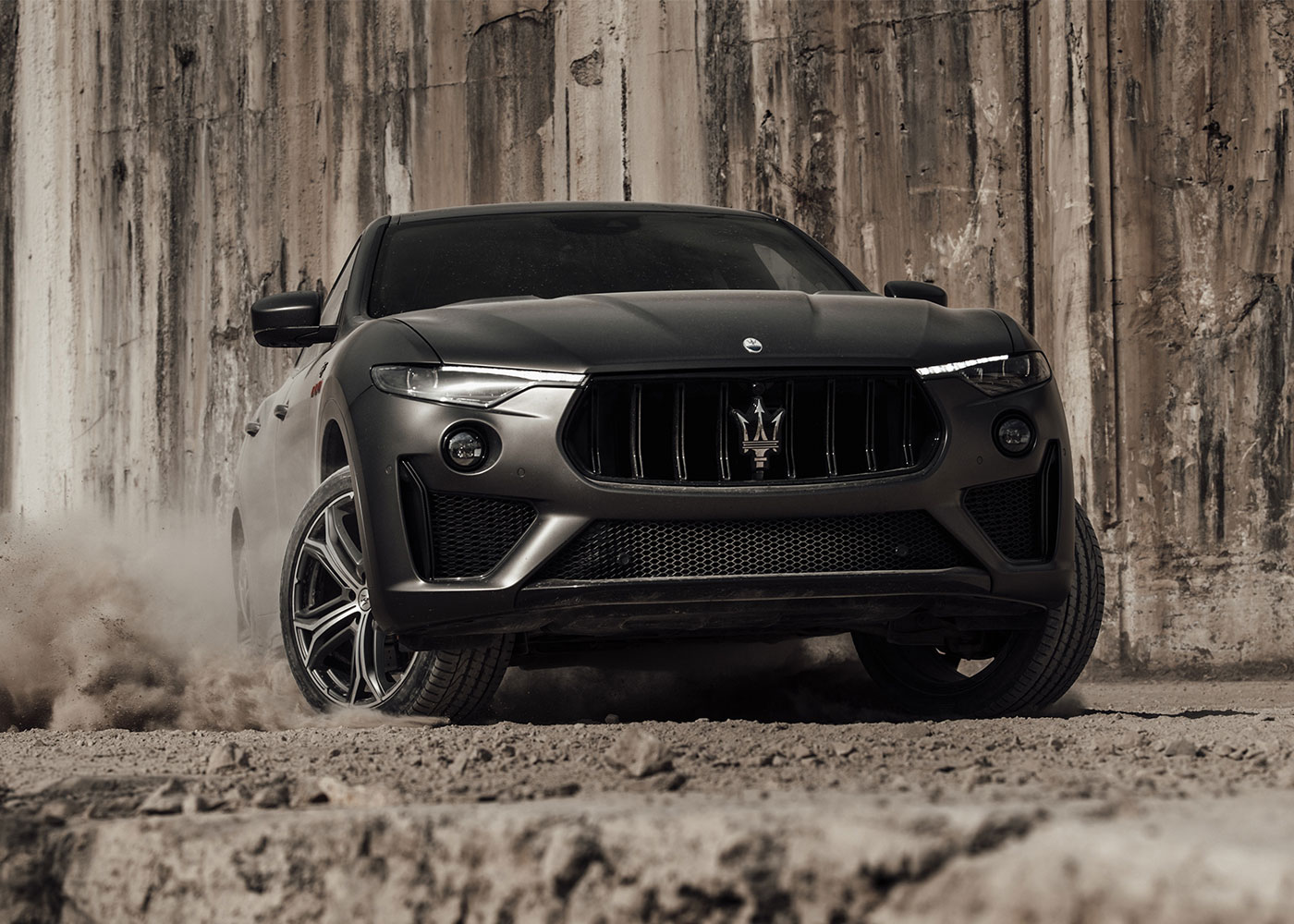 Maserati Levante Trofeo SUV navigates rugged terrain.