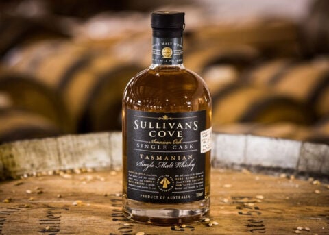 A Sullivans Cove Whisky bottle on barrel.