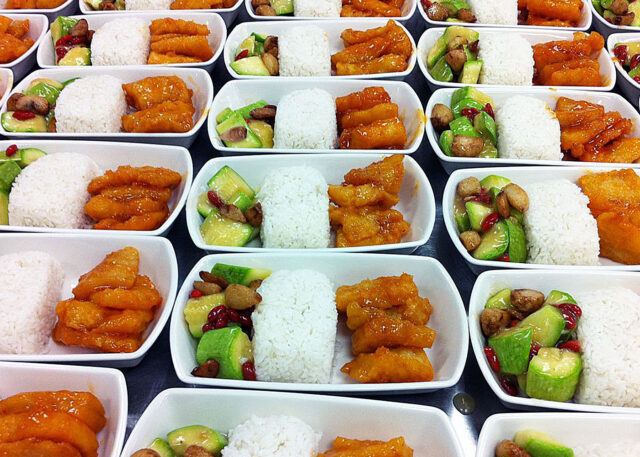 Rows of trays with gourmet meals, unlike airlines.