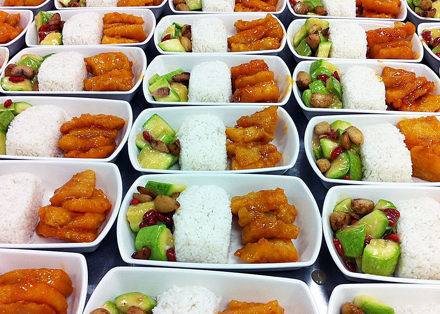 Rows of trays with gourmet meals, unlike airlines.