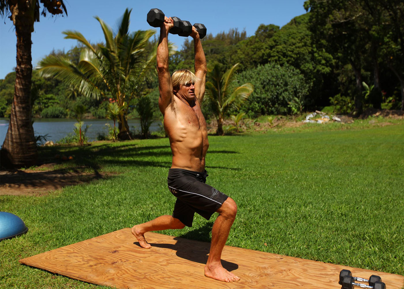 Lunging with dumbbells, inspired by Laird Hamilton.