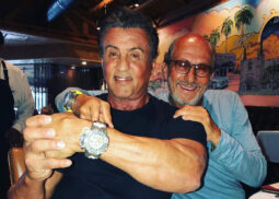 Two men smile indoors; Richard Mille Tourbillon visible.