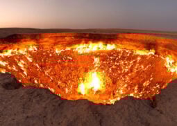 Darvaza gas crater: mesmerizing flames under clear sky.