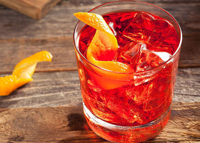 Non-alcoholic red cocktail with an orange twist.