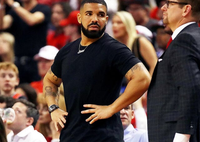 Man in black T-shirt with Richard Mille watch.