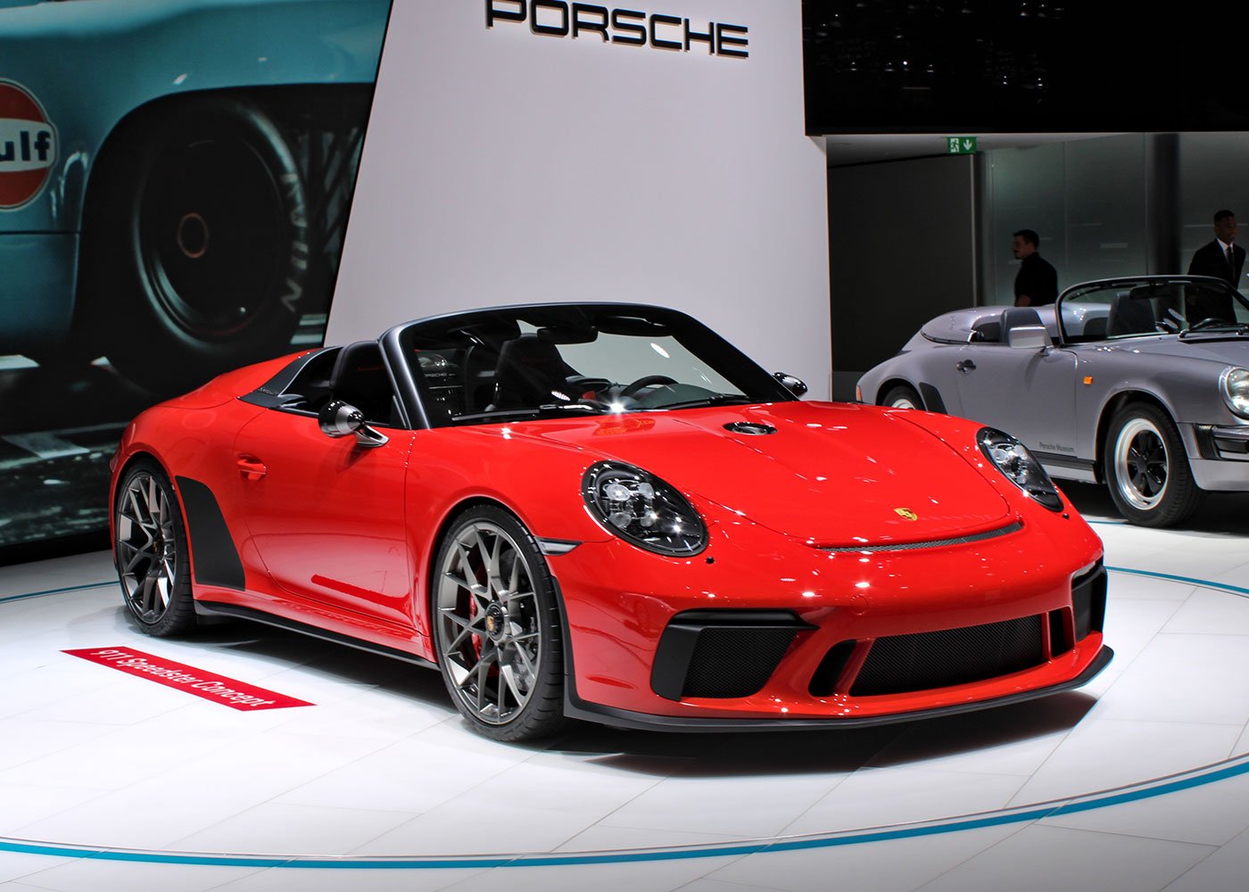 Red Porsche 911 Speedster at car show.