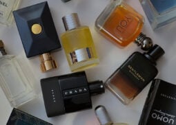 Prada and Givenchy perfumes in assorted colors.