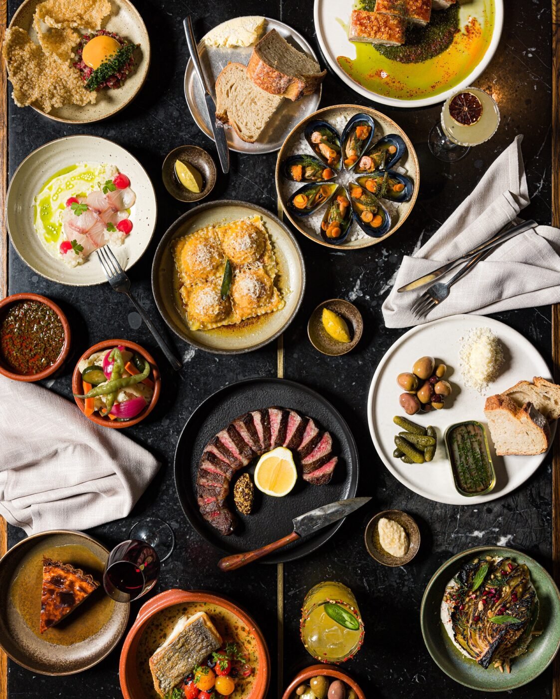 Australian table features diverse dishes and drinks.
