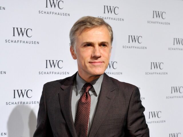 Person in suit echoes Christoph Waltz's style at IWC Schaffhausen event.