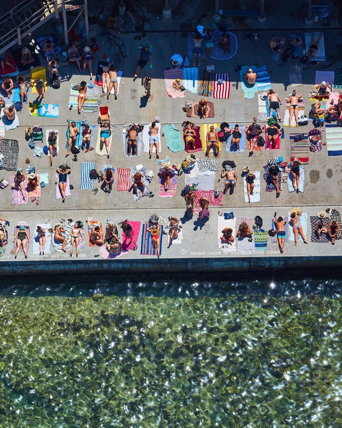 Aerial view of sunbathers in vibrant Australia.