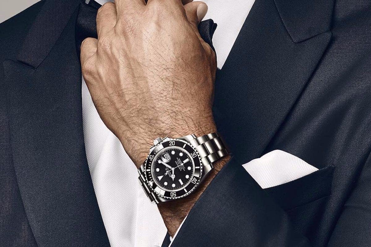 rolex submariner with a suit