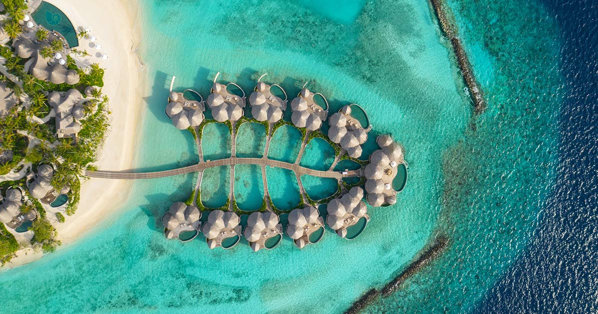 Nautilus Maldives: overwater bungalows, beach.