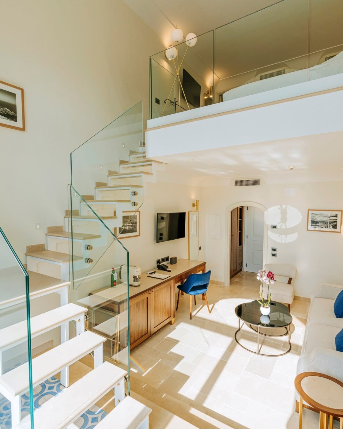Luxurious sunlit loft with mezzanine bedroom.