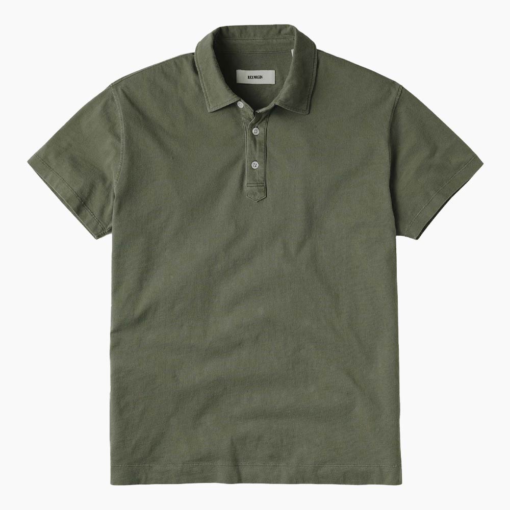 Green polo shirt with short sleeves and buttons.
