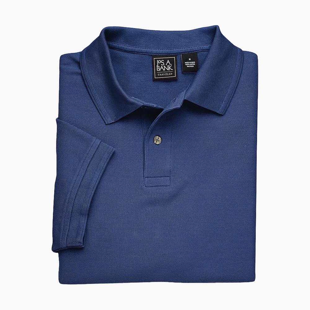 Folded navy polo shirt with size tag displayed.