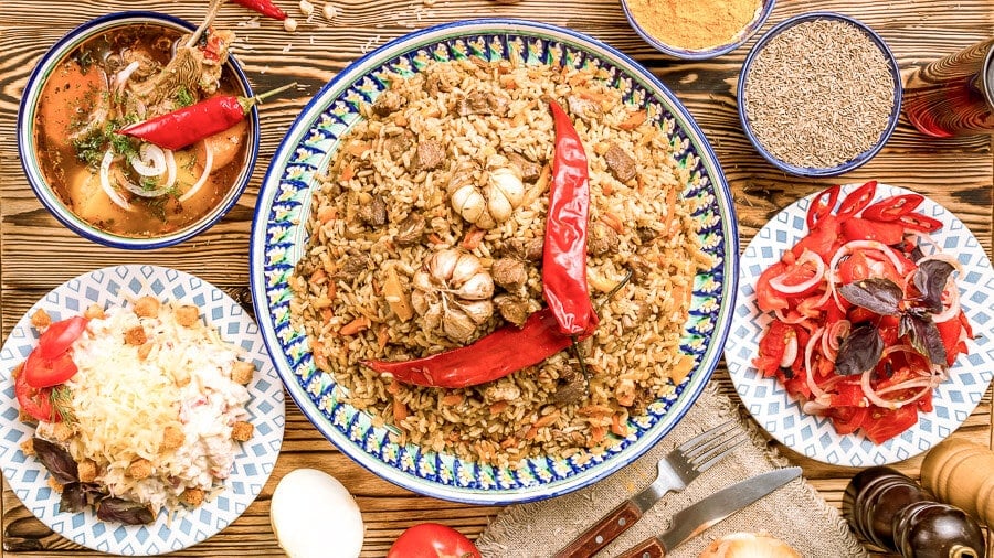 Foodie's feast: rice, meat, salad, spices.
