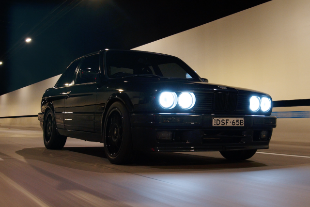 Classic black car with "DSF-65B" in Australia.