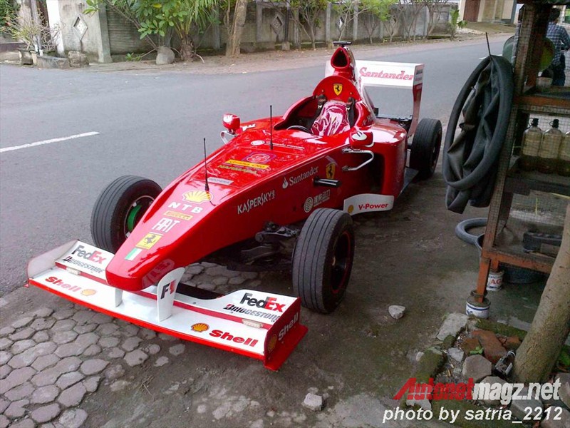 A Bali F1 Replica car with sponsors, Shell and FedEx.