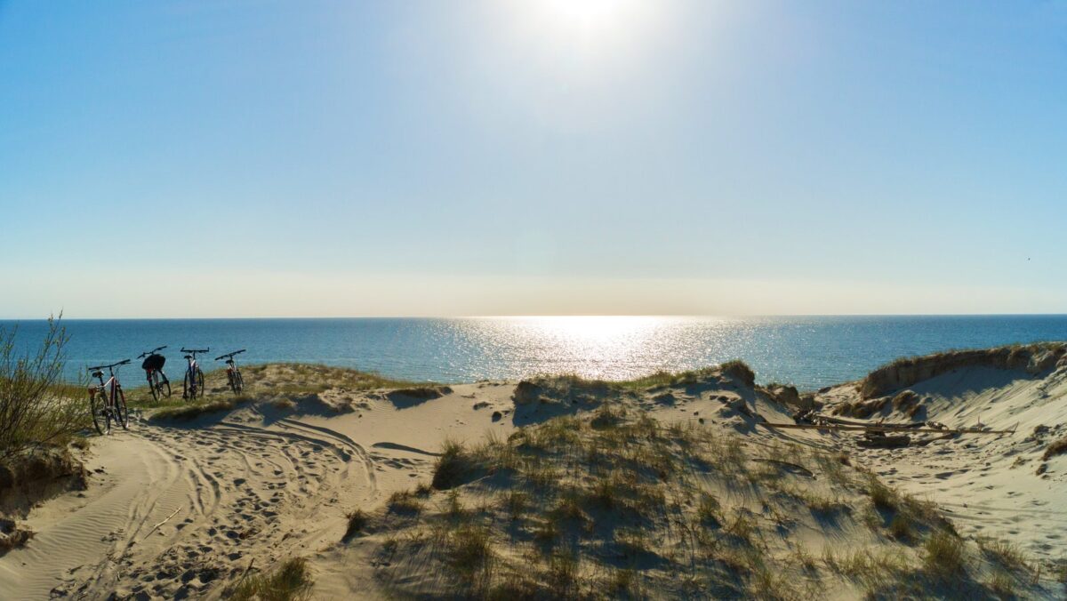 Lithuanian beach with bicycles and sparkling ocean.