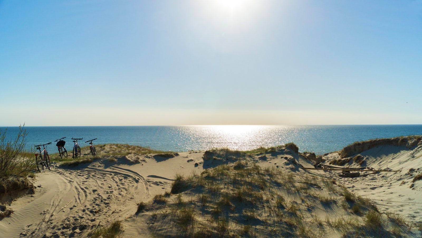 Lithuanian beach with bicycles and sparkling ocean.