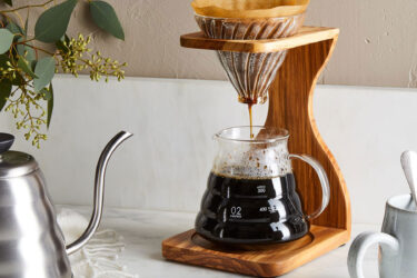 Wooden coffee stand brews aromatic coffee.