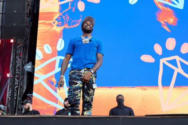 Rapper on stage with Richard Mille watch.