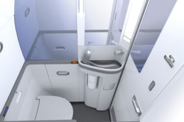 Sleek airplane bathroom with modern design features.