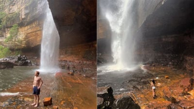 Two people enjoy Gerringong Falls' stunning scenery.