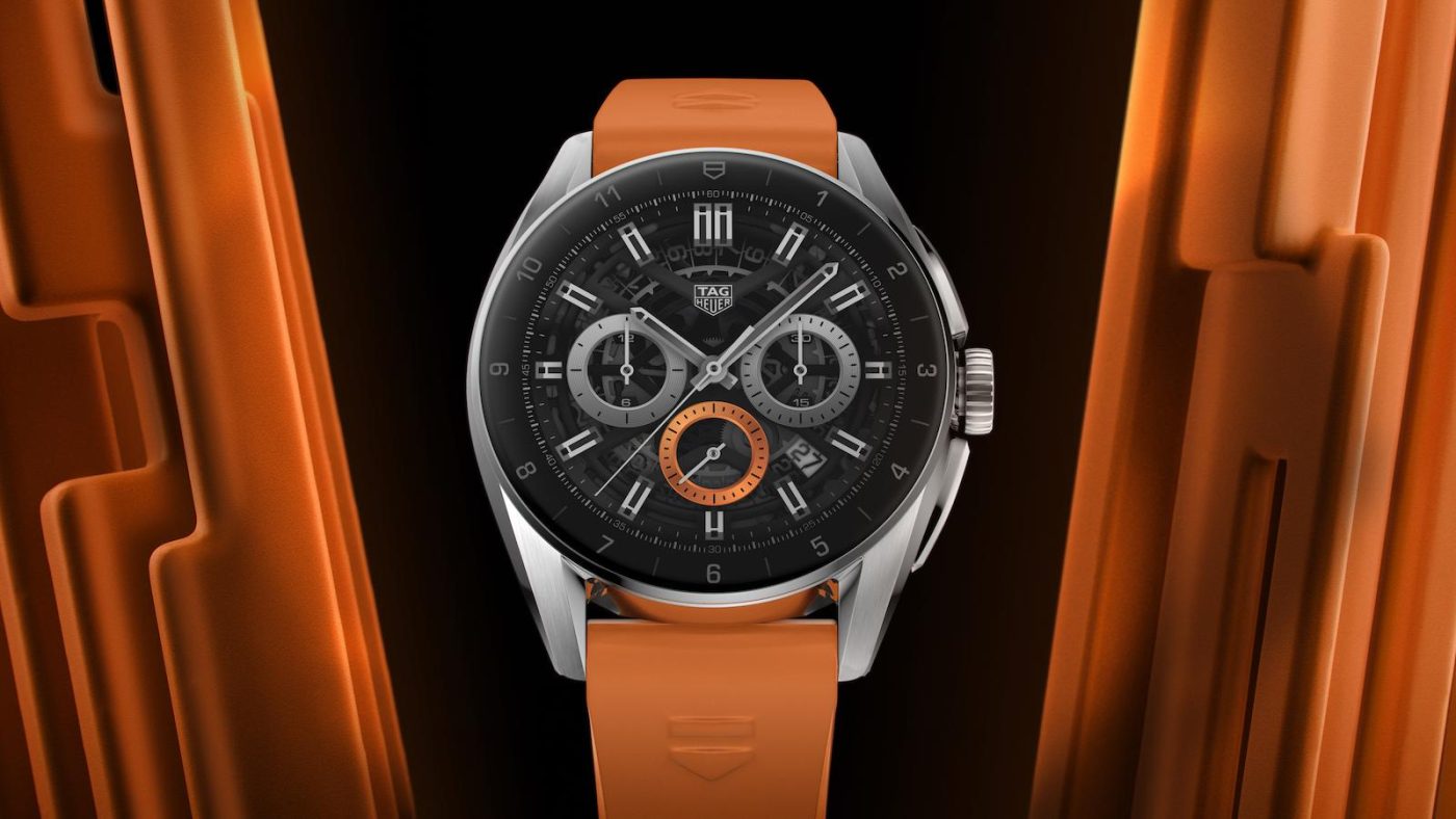 TAG Heuer watch with bold orange accents.