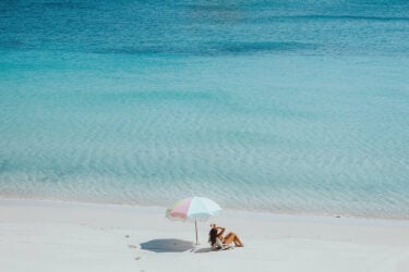 A person relaxes on Australia's pristine beach.