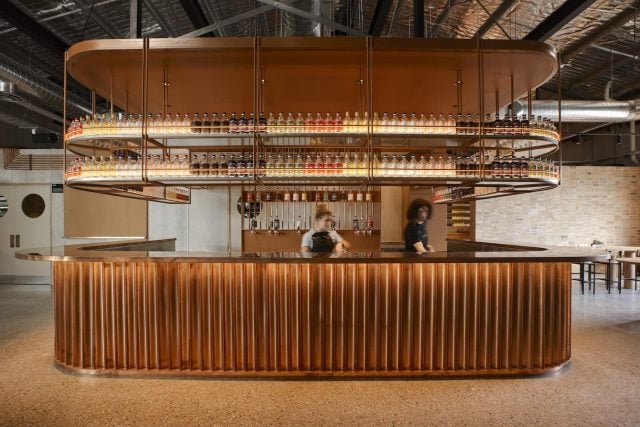 Stylish bar with gin bottles and modern elements.
