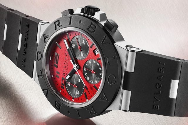 Bulgari watch: red dial, black rubber strap.