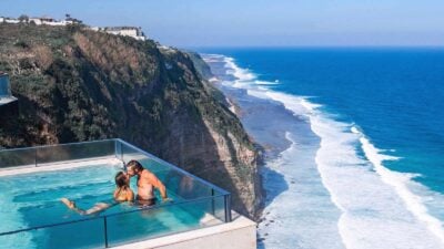 Couple in infinity pool captures Instagram-worthy moment.