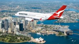 Qantas A380 flies over Sydney landmarks.