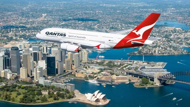 Qantas A380 flies over Sydney landmarks.