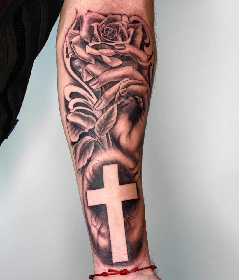 Cross forearm tattoo