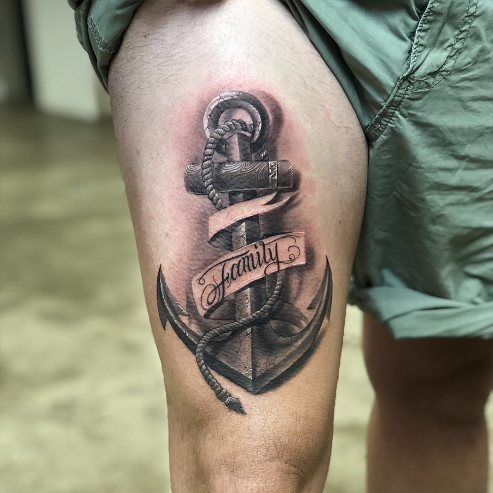 Gand poked anchor tattoo located on the thigh