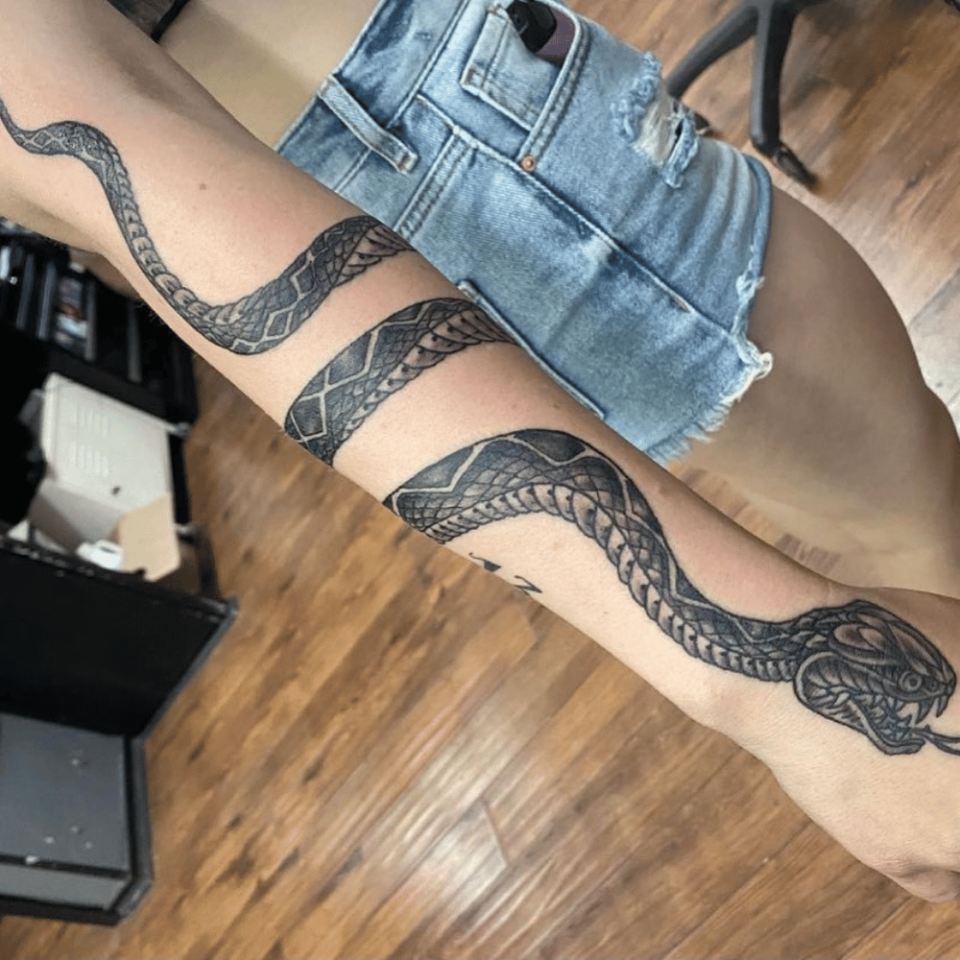 It does not matter if you are male or female snake tattoo will look special  on your forearm