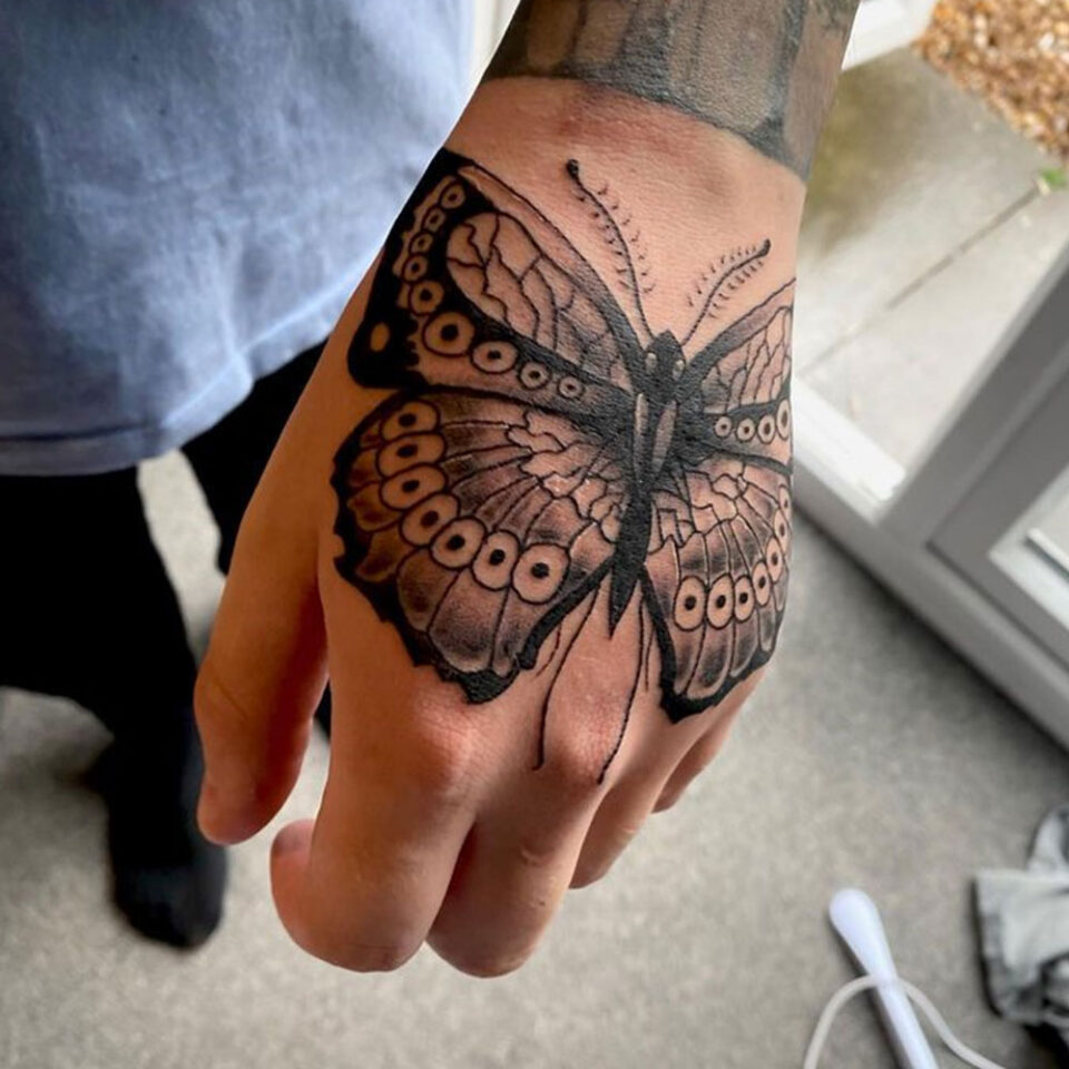 butterfly hand tattoo @kirst_tattoo_artist_via Instagram