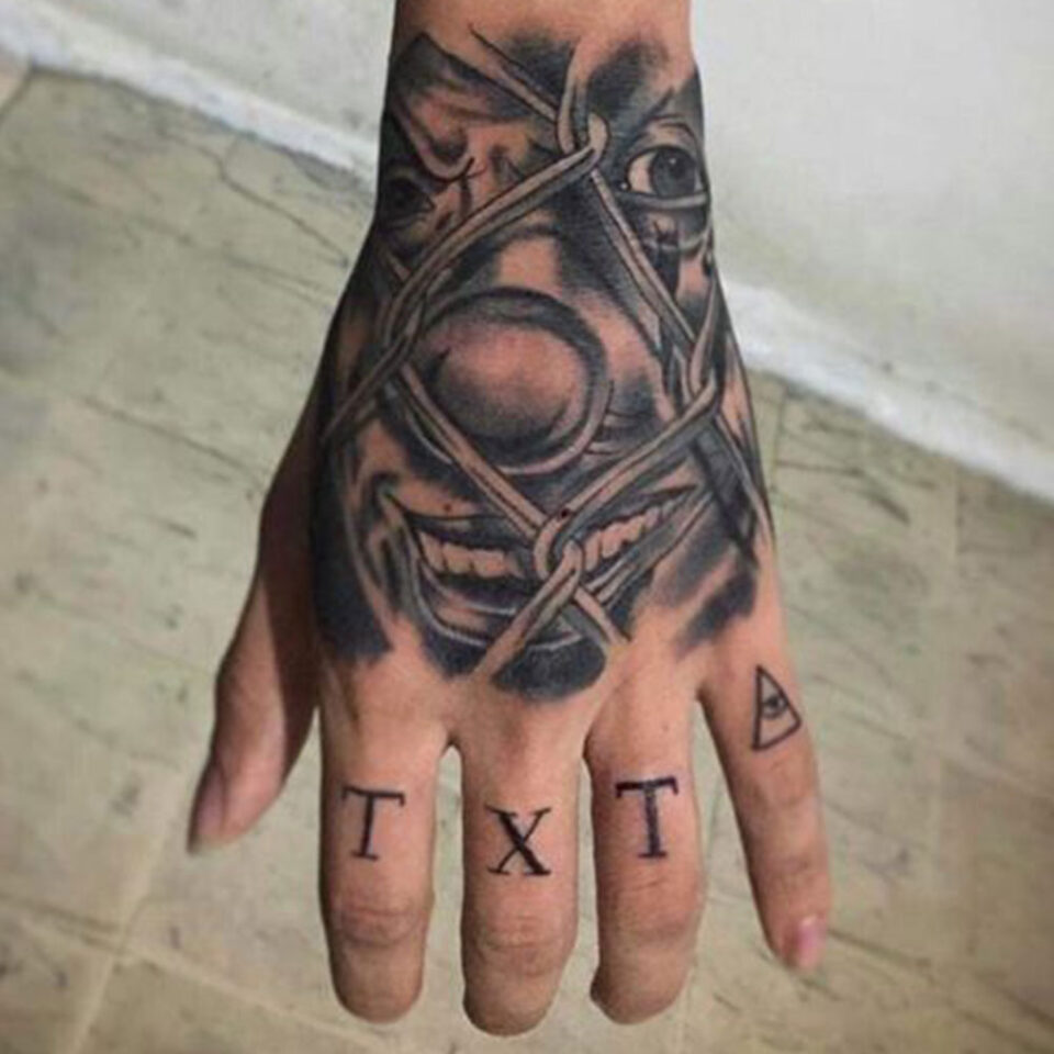 clown hand tattoo