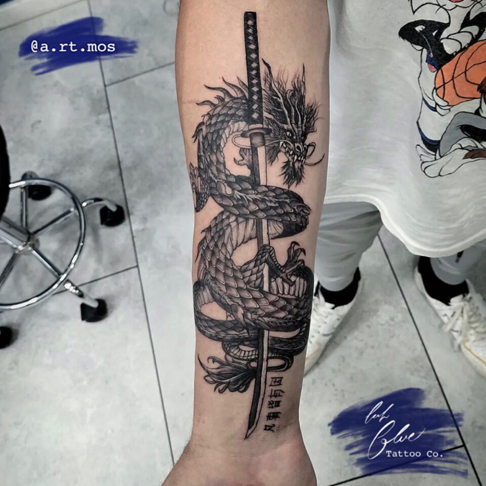 Dragon on a dice sword by Cody at distinction galleries in Salt Lake City   rtattoos
