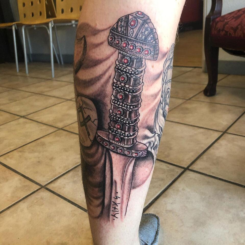 Not a real sword but this is my damascus steel tattoo I just got yesterday   rSWORDS