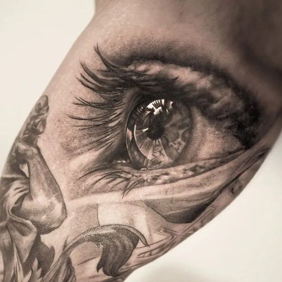 Eye Peering through Skin Realism Tattoo Source @hawink_jack via Pinterest