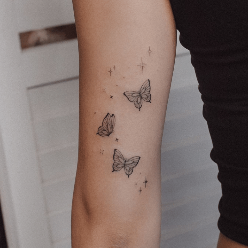 butterfly and stars tattoos on wrist